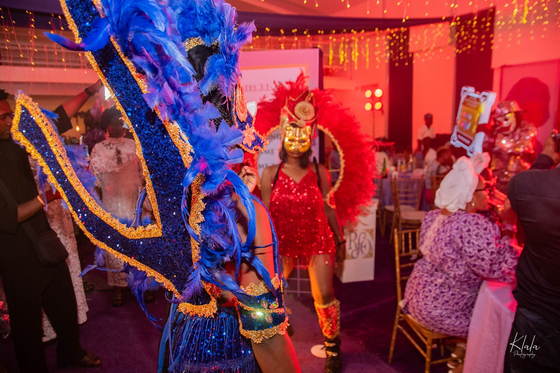 Birthday party performer carrying drink display