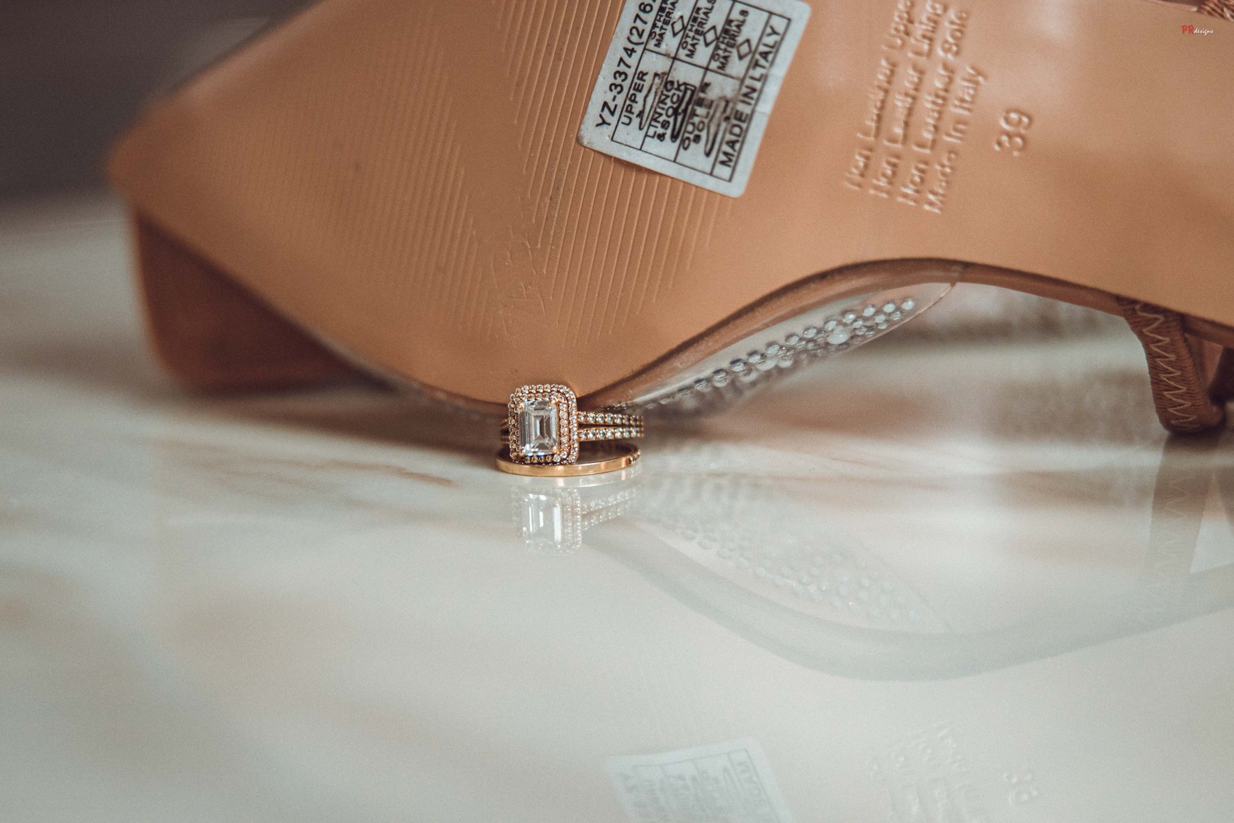 Wedding ring styled with bridal shoe